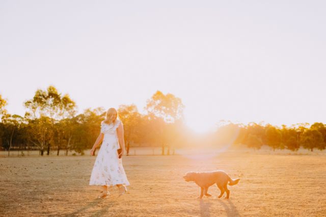 Cassie Argus enjoying a sunset walk with her dog, on her rural property in Bendigo.