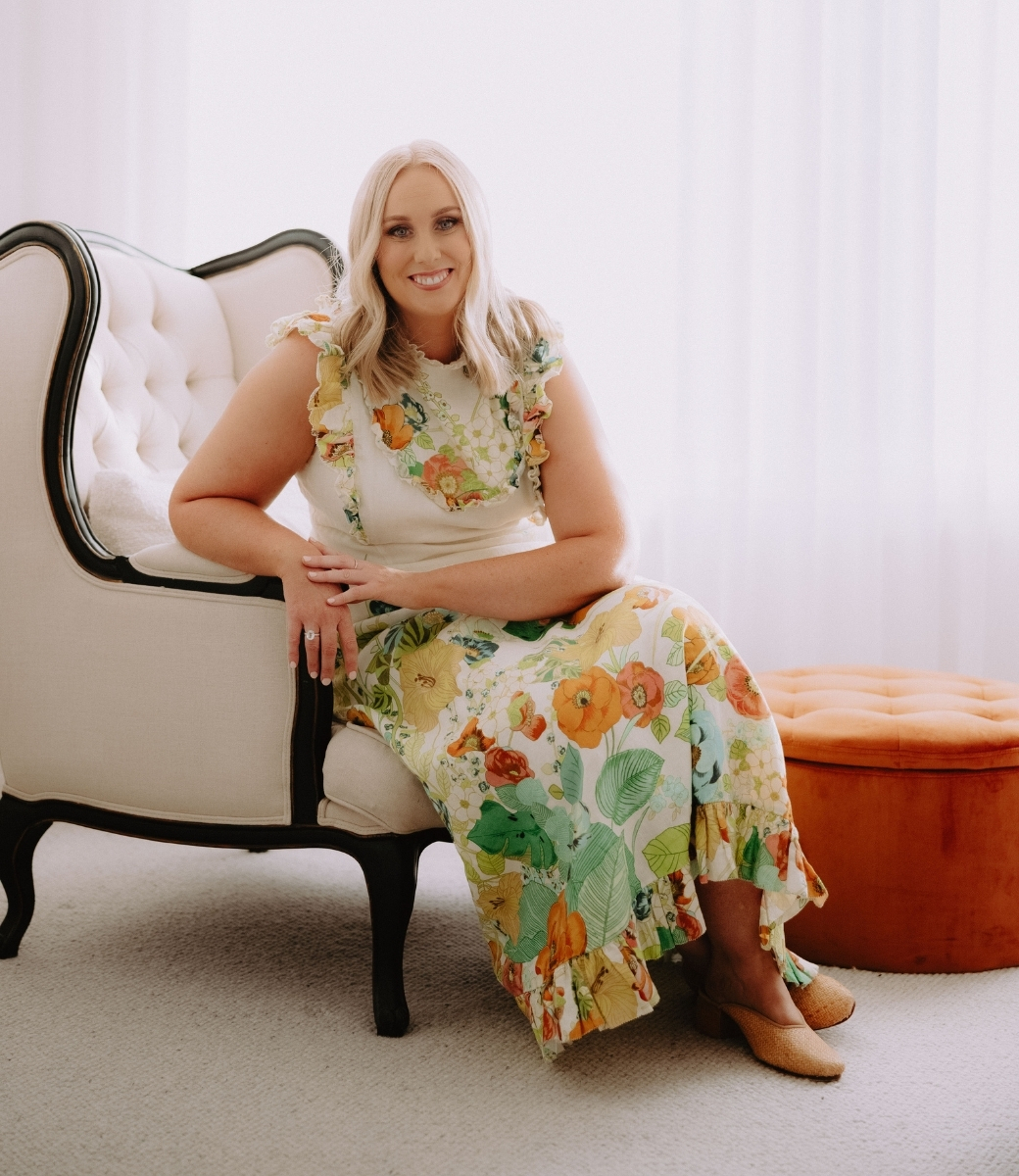 Portrait of Cassandra Argus, an inviting and highly professional wedding celebrant, sitting comfortably in her Central Victoria home.